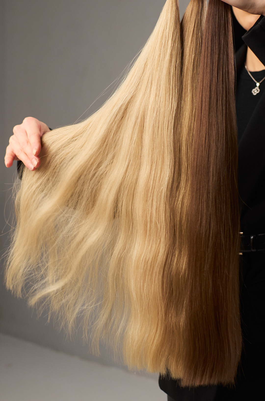 Hair extension specialist presenting premium Hairblend samples